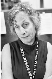 Linda Hamilton srugs with resignation