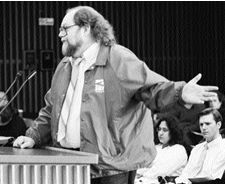 O'Grady wearing Local 535 jacket jestures as he addresses the hearings
