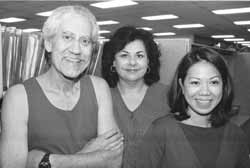 three social workers standing by files