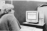 Dependency investigator, Pamela Winthers staring at a computer screen