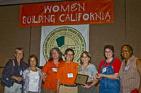 Women on boradmembers of Trades Women Inc posing at conference