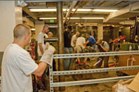 Plumbing students working on a project