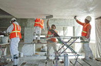 plasterers working on ceiling