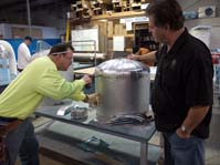 Instructor with apprentice wraping a vent