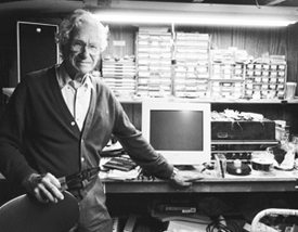 Ted Veltfort at his work bench with computer and electrical parts